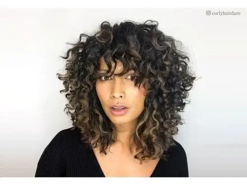 Coiled Curly Hair With Layers And Bangs