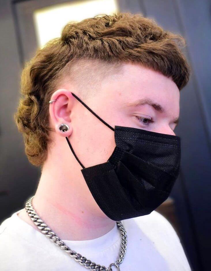 Thick Rusty Mullet with High Fade haircut