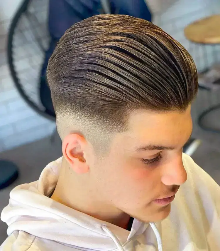 Neat Slick Back with A Mid Skin Fade haircut